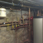 Indirect storage water heater for space heating and domestic hot water after