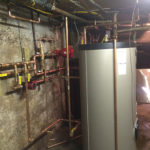 Indirect storage water heater for space heating and domestic hot water side after